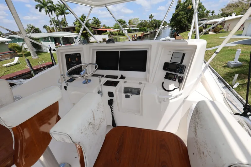  Yacht Photos Pics Bertram 511 yacht cockpit, 2012 model, featuring navigation controls and seating.