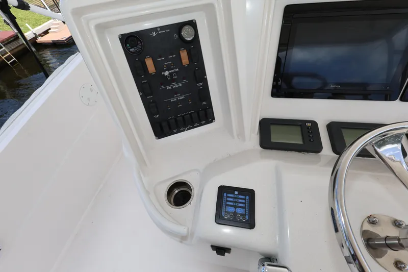  Yacht Photos Pics Control panel of a 2012 Bertram 511 yacht with gauges and displays.