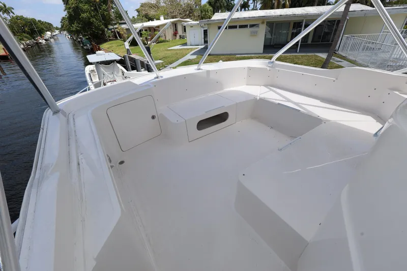  Yacht Photos Pics Spacious deck of 2012 Bertram 511 boat, featuring white seating and storage compartments.