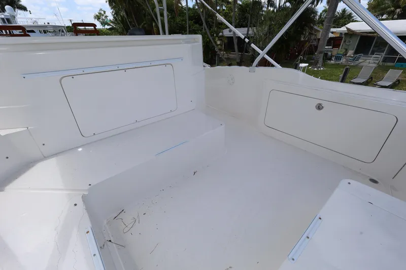  Yacht Photos Pics 2012 Bertram 511 boat deck with storage compartments, clean and spacious layout.