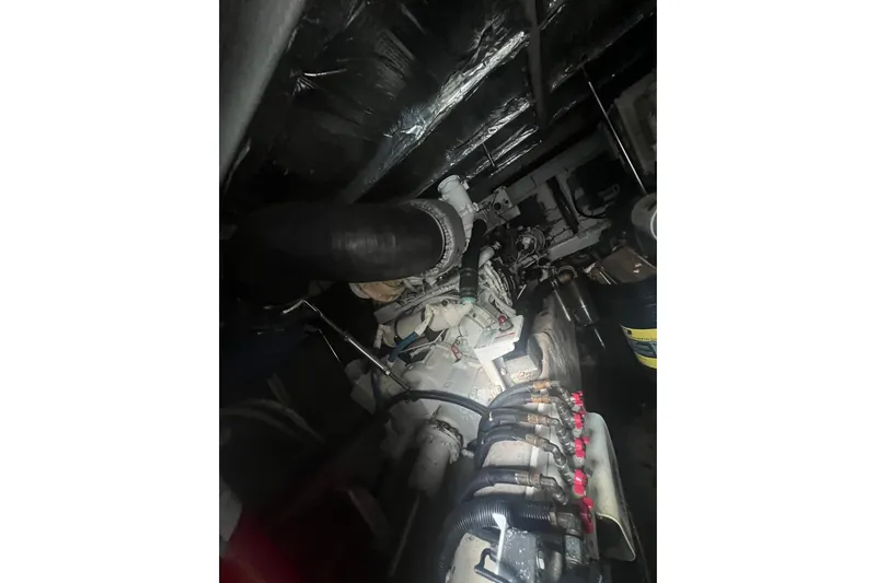  Yacht Photos Pics Engine room of a 2007 Sea Ray 52 Sedan Bridge yacht, showcasing mechanical components.