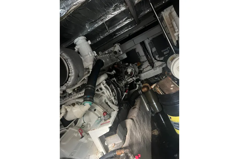  Yacht Photos Pics Engine room of 2007 Sea Ray 52 Sedan Bridge yacht, showcasing mechanical components.