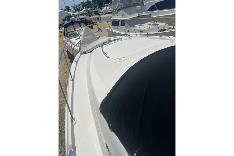  Yacht Photos Pics 2007 Sea Ray 52 Sedan Bridge yacht docked at marina, showcasing sleek design.