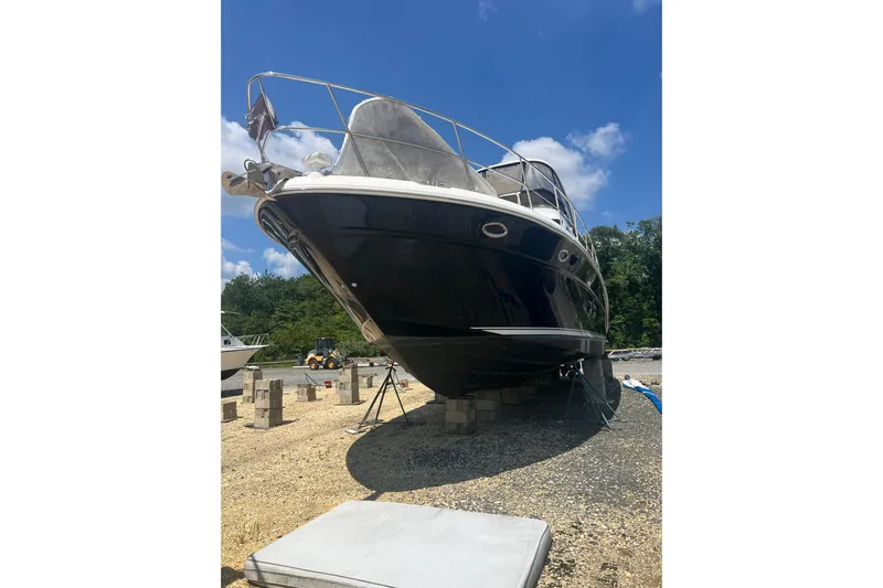 Yacht Photos Pics 2007 Sea Ray 52 Sedan Bridge yacht on dry dock under clear blue sky.