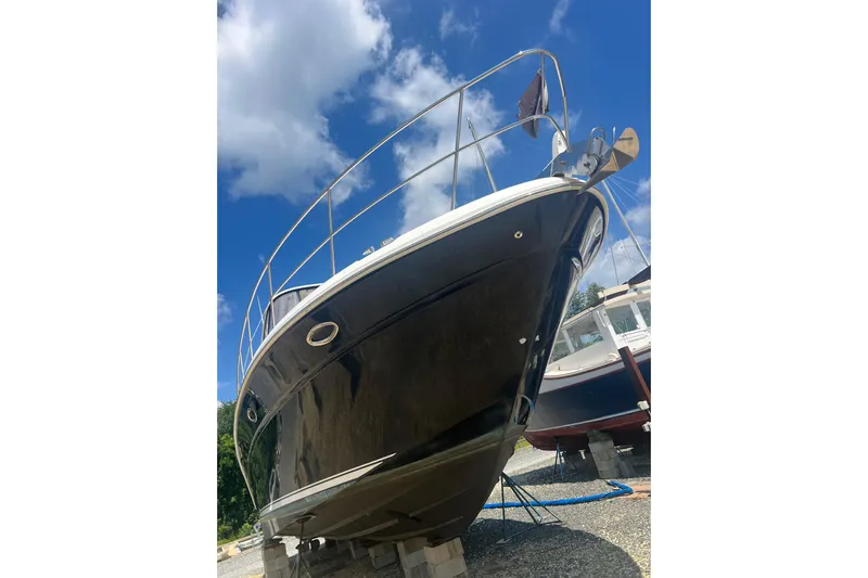  Yacht Photos Pics 2007 Sea Ray 52 Sedan Bridge yacht on dry dock under a clear blue sky.