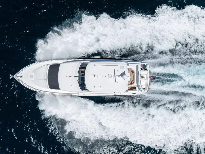 Griffin Yacht Photos Pics Aerial view of 2013 Hatteras 80 Motor Yacht cruising on open water.