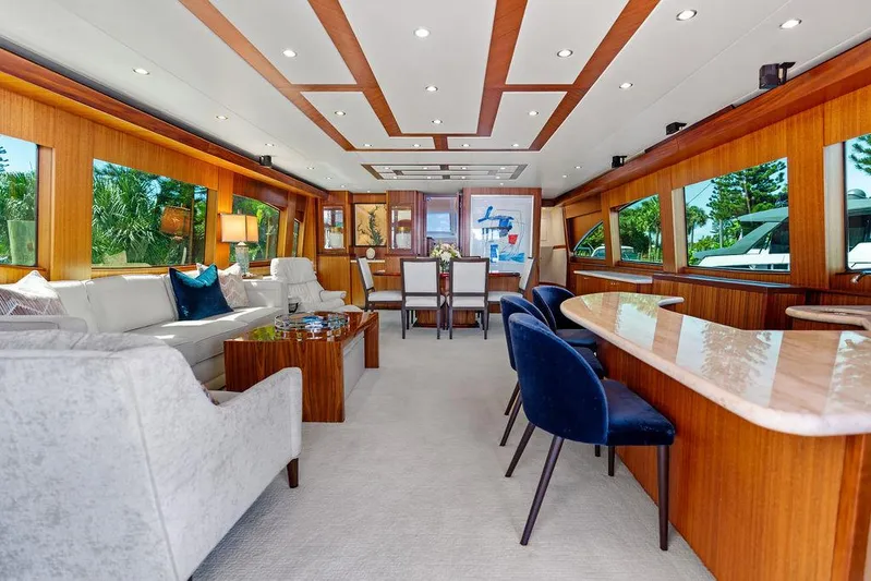 Griffin Yacht Photos Pics Luxurious interior of 2013 Hatteras 80 Motor Yacht with elegant seating and wood accents.