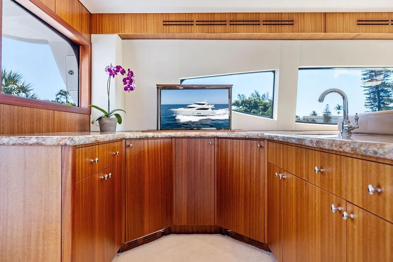 Griffin Yacht Photos Pics Luxurious interior of 2013 Hatteras 80 Motor Yacht with wood cabinetry and elegant decor.