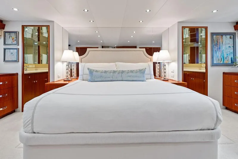 Griffin Yacht Photos Pics Luxurious bedroom interior of 2013 Hatteras 80 Motor Yacht with elegant furnishings.