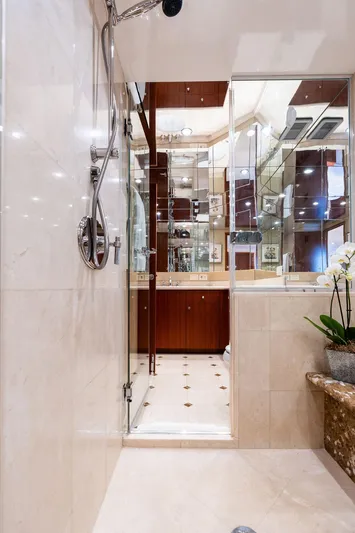 Griffin Yacht Photos Pics Luxurious bathroom in 2013 Hatteras 80 Motor Yacht with elegant shower and marble accents.