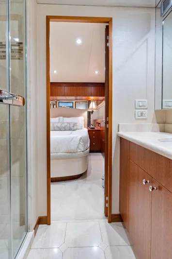 Griffin Yacht Photos Pics Luxurious interior of 2013 Hatteras 80 Motor Yacht, featuring a bedroom and bathroom.