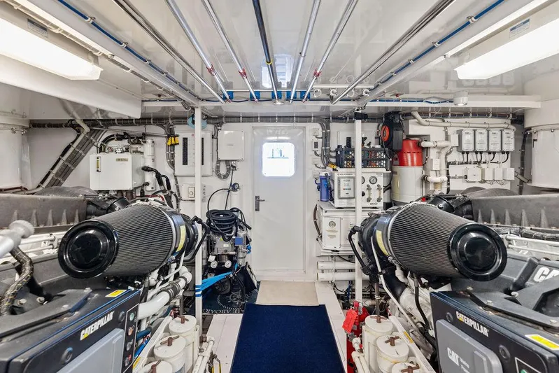 Griffin Yacht Photos Pics Engine room of 2013 Hatteras 80 Motor Yacht with Caterpillar engines and control systems.