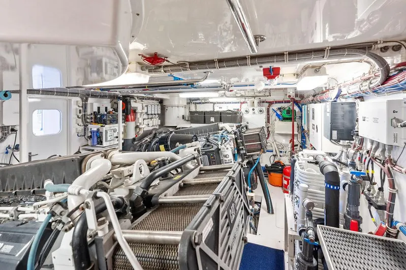 Griffin Yacht Photos Pics Engine room of 2013 Hatteras 80 Motor Yacht, featuring complex machinery and equipment.
