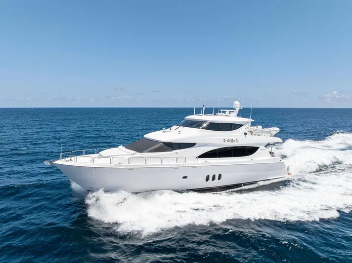 Griffin Yacht Photos Pics 2013 Hatteras 80 Motor Yacht cruising on open sea under clear blue sky.