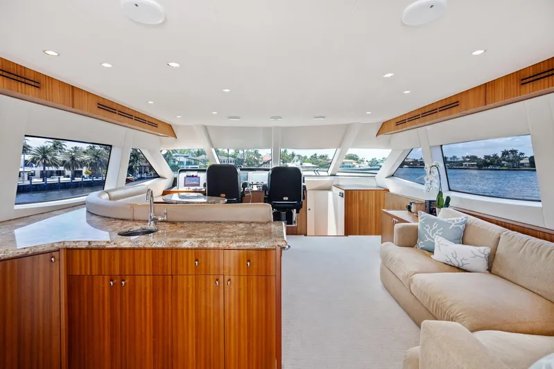 Griffin Yacht Photos Pics Luxurious interior of 2013 Hatteras 80 Motor Yacht with elegant wood finishes and spacious seating.