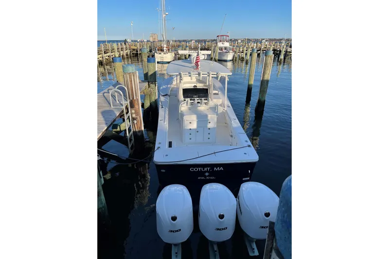 Flag Blue Yacht Photos Pics 2018 Regulator 34SS boat docked with triple 300 horsepower engines.