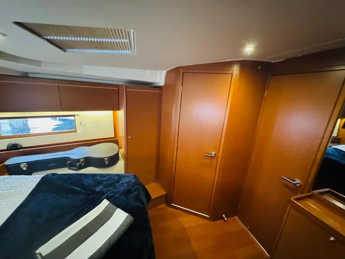Flight Risk Yacht Photos Pics Luxurious cabin interior of 2020 Beneteau Oceanis 51.1 yacht with wood finish.