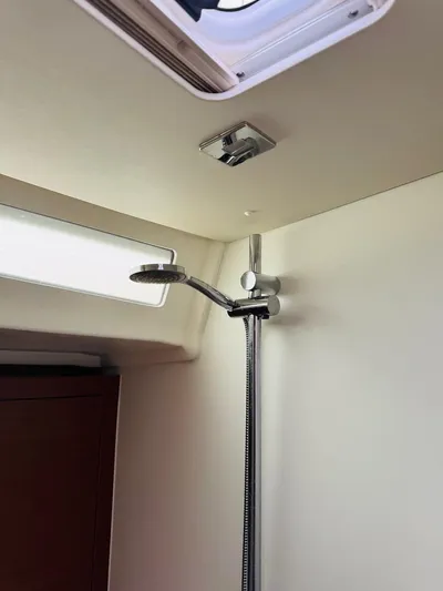 Flight Risk Yacht Photos Pics Beneteau Oceanis 51.1 2020 yacht shower area with modern fixtures and natural light.