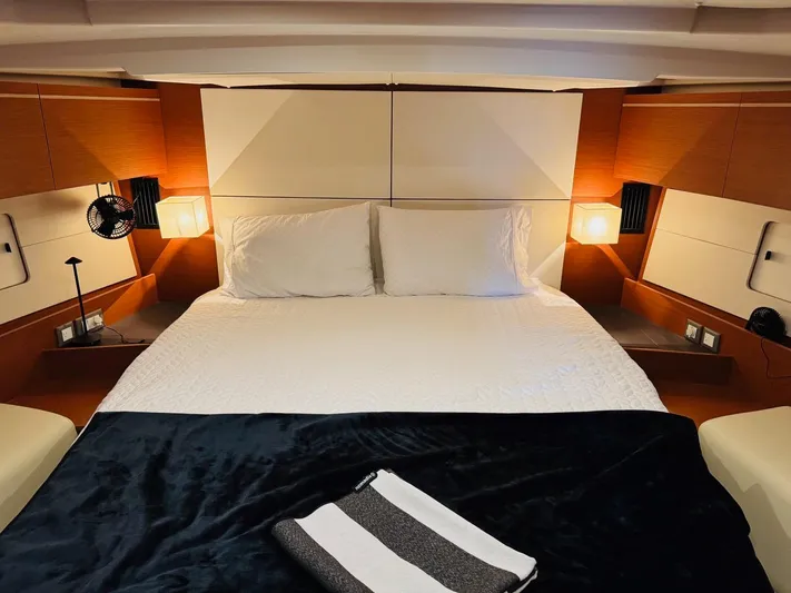 Flight Risk Yacht Photos Pics Luxurious cabin interior of 2020 Beneteau Oceanis 51.1 yacht with cozy bedding.