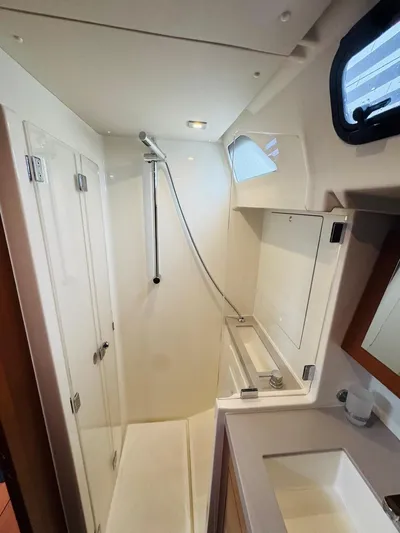 Flight Risk Yacht Photos Pics Beneteau Oceanis 51.1 2020 yacht bathroom with shower, sink, and mirror.