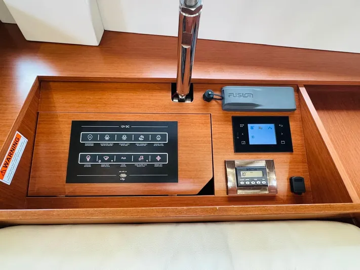 Flight Risk Yacht Photos Pics Control panel of a 2020 Beneteau Oceanis 51.1 yacht with Fusion audio system.