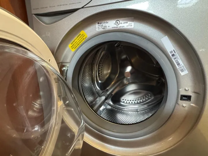 Flight Risk Yacht Photos Pics Open washing machine door on a Beneteau Oceanis 51.1 yacht, 2020 model.