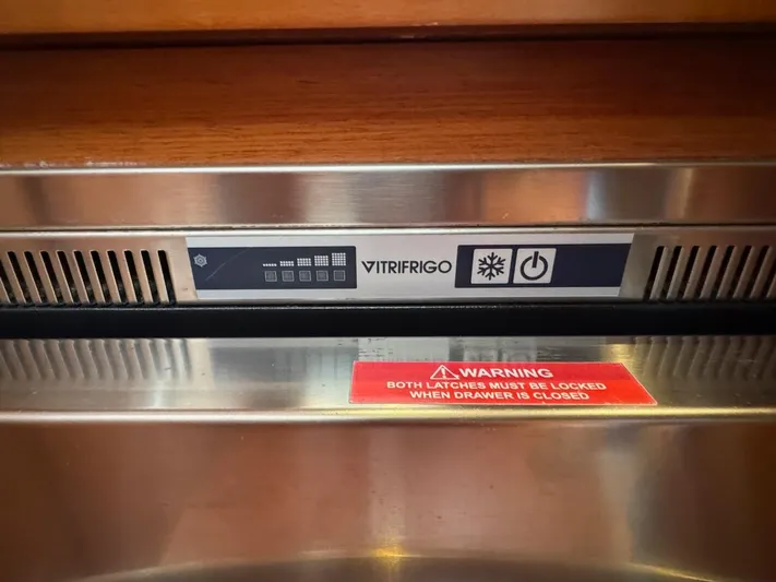 Flight Risk Yacht Photos Pics Vitrifrigo refrigerator control panel on 2020 Beneteau Oceanis 51.1 yacht, with safety warning label.