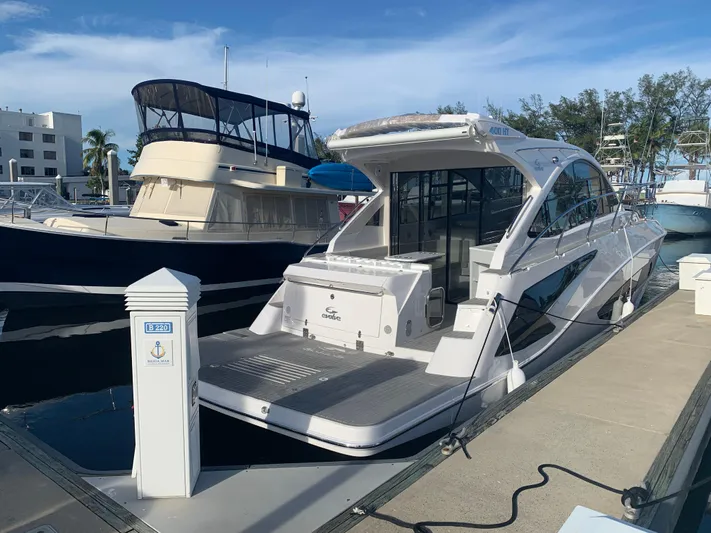 Romaniac Yacht Photos Pics Luxury Evolve 400HT yacht docked at marina, 2021 model.