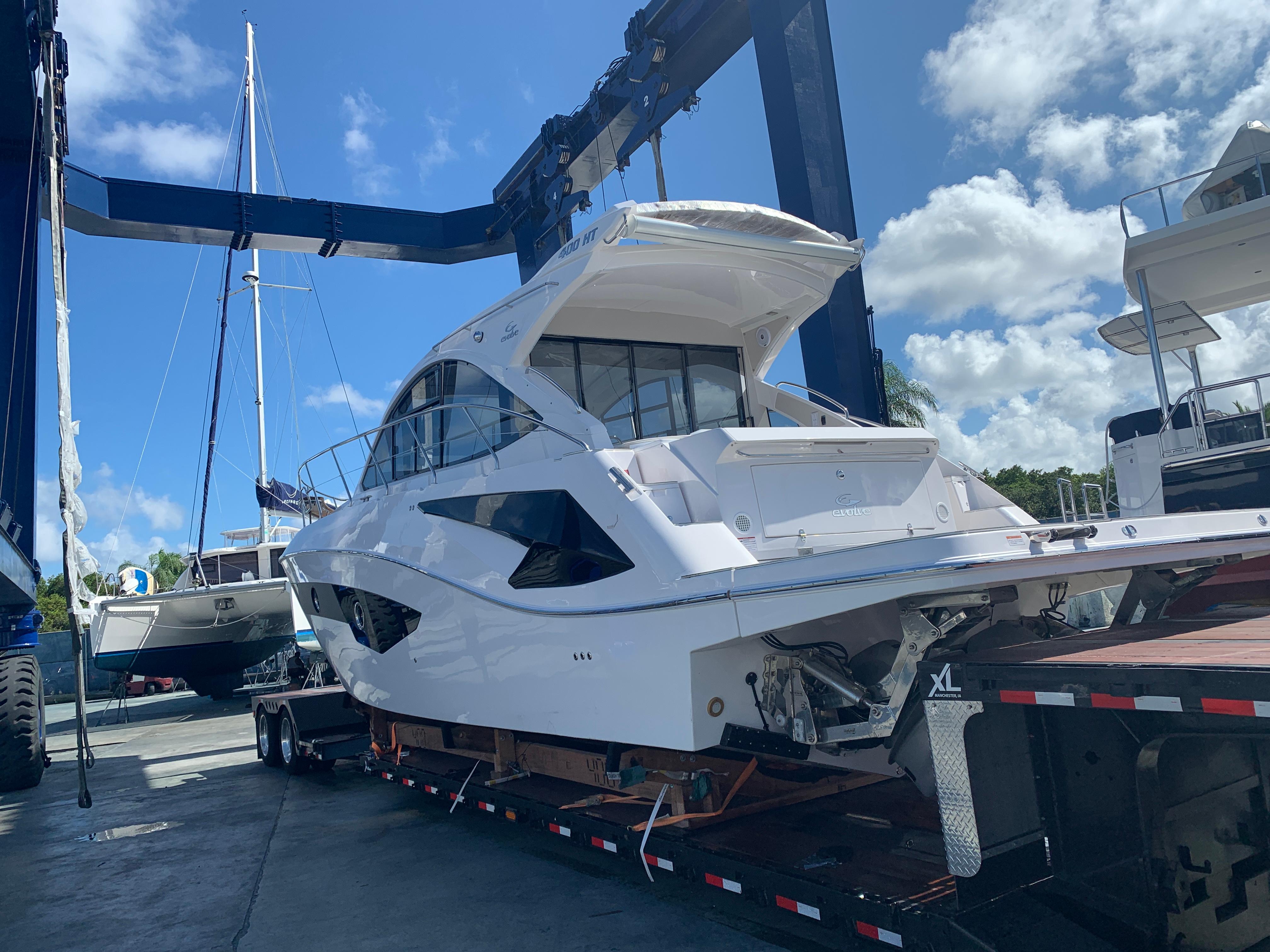 2021 Evolve 400HT yacht on trailer, ready for transport under clear blue sky.