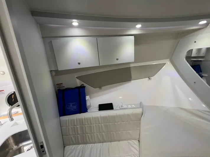 Romaniac Yacht Photos Pics Interior of 2021 Evolve 400HT boat with modern seating and storage cabinets.