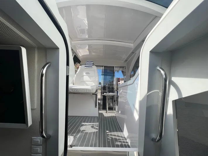 Romaniac Yacht Photos Pics Interior view of 2021 Evolve 400HT yacht, featuring sleek design and modern seating.