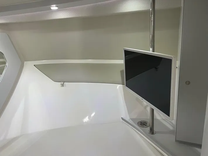 Romaniac Yacht Photos Pics Interior of 2021 Evolve 400HT yacht with mounted TV and modern design.