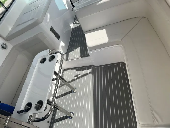 Romaniac Yacht Photos Pics 2021 Evolve 400HT boat interior with white seating and sleek table design.