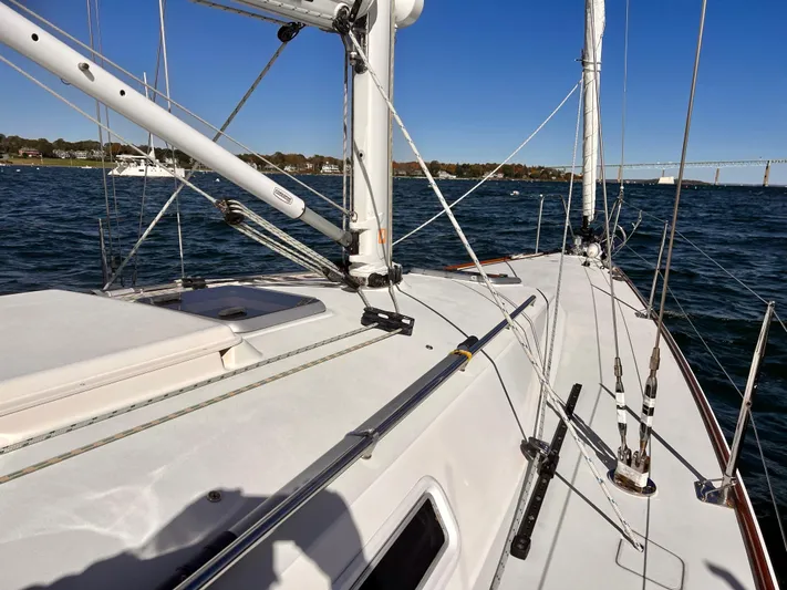 Airwaves Yacht Photos Pics Sailing yacht J Boats J/124, 2006 model, on water with clear blue sky.
