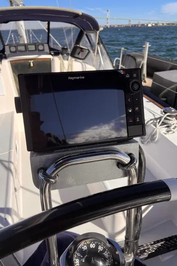 Airwaves Yacht Photos Pics 2006 J Boats J/124 sailboat cockpit with navigation equipment and steering wheel.