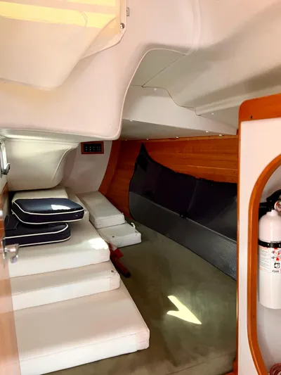 Airwaves Yacht Photos Pics Interior of 2006 J Boats J/124 sailboat, featuring seating and safety equipment.