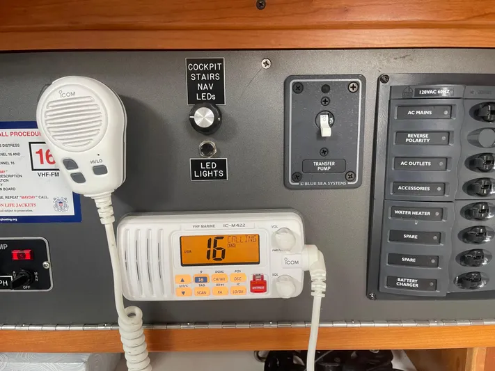 Airwaves Yacht Photos Pics Control panel of a 2006 J Boats J/124, featuring radio and LED light switches.