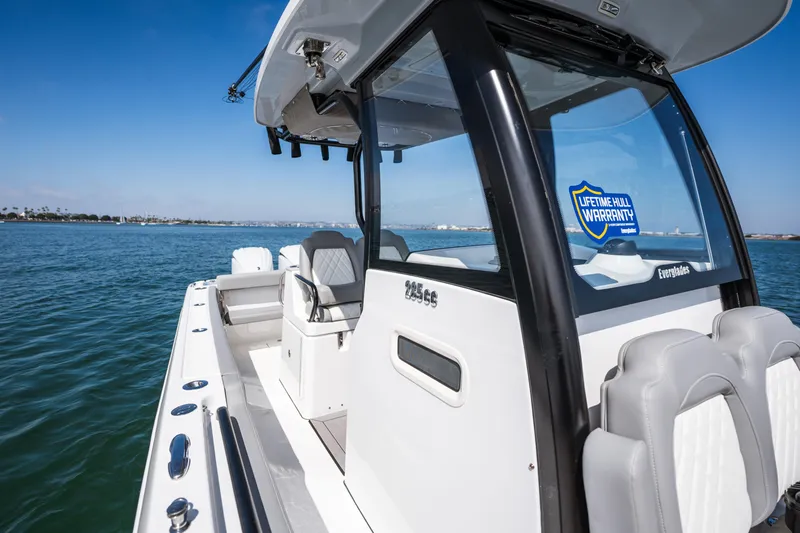 Shark Bait Yacht Photos Pics 2025 Everglades 285 Center Console boat on water, featuring lifetime hull warranty.