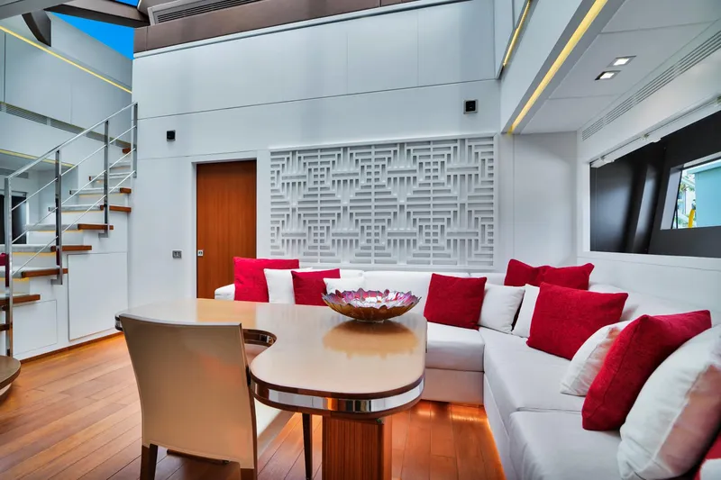 Diamond Yacht Photos Pics Modern yacht interior with white and red cushions, wooden flooring, and decorative wall panel. AB 116, 2012.