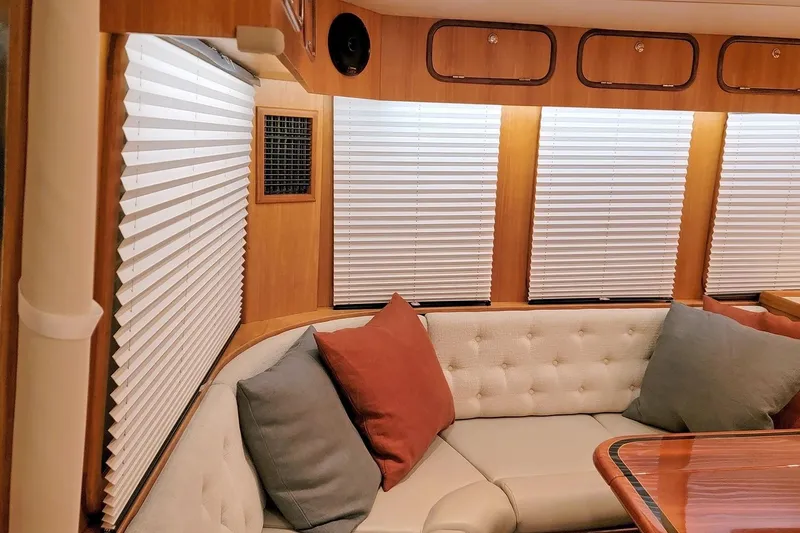 Carolina Yacht Photos Pics Luxurious interior of 2001 Nordhavn 46 yacht with plush seating and elegant wood finishes.