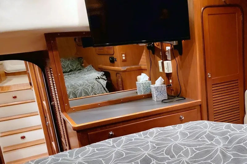 Carolina Yacht Photos Pics Interior of a 2001 Nordhavn 46 yacht, featuring a cozy cabin with wood finishes.