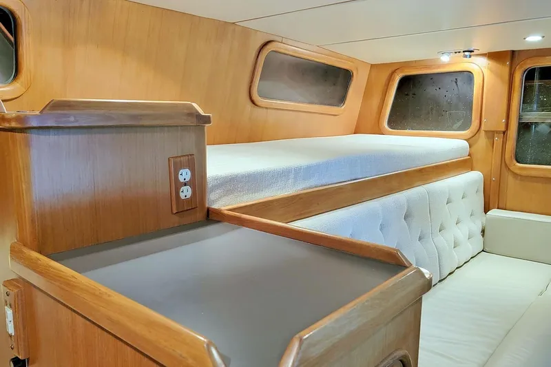 Carolina Yacht Photos Pics 2001 Nordhavn 46 interior cabin with wooden finish and comfortable seating.