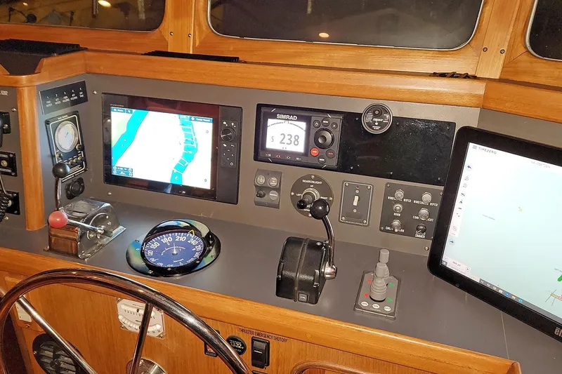 Carolina Yacht Photos Pics Helm of 2001 Nordhavn 46 yacht with navigation and control instruments.