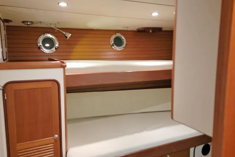 Carolina Yacht Photos Pics 2001 Nordhavn 46 yacht interior with wooden bunk beds and portholes.