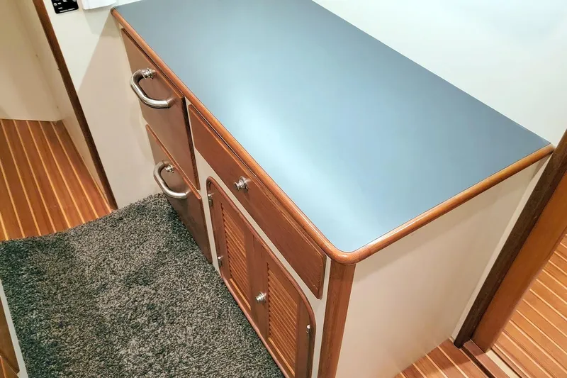 Carolina Yacht Photos Pics 2001 Nordhavn 46 interior with wooden cabinetry and blue countertop.