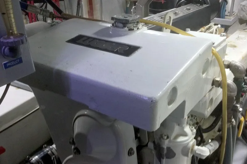 Carolina Yacht Photos Pics Engine room of a 2001 Nordhavn 46 yacht, showcasing mechanical components.