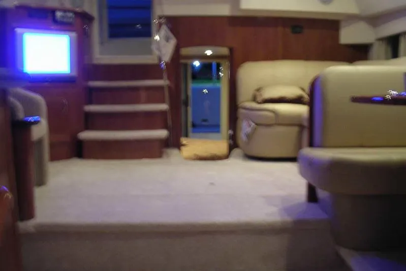  Yacht Photos Pics Interior of 2006 Carver 41 Cockpit Motor Yacht with cozy seating and carpeted steps.