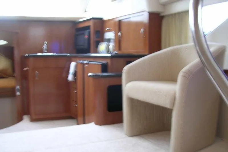  Yacht Photos Pics Interior of 2006 Carver 41 Cockpit Motor Yacht with kitchen and seating area.