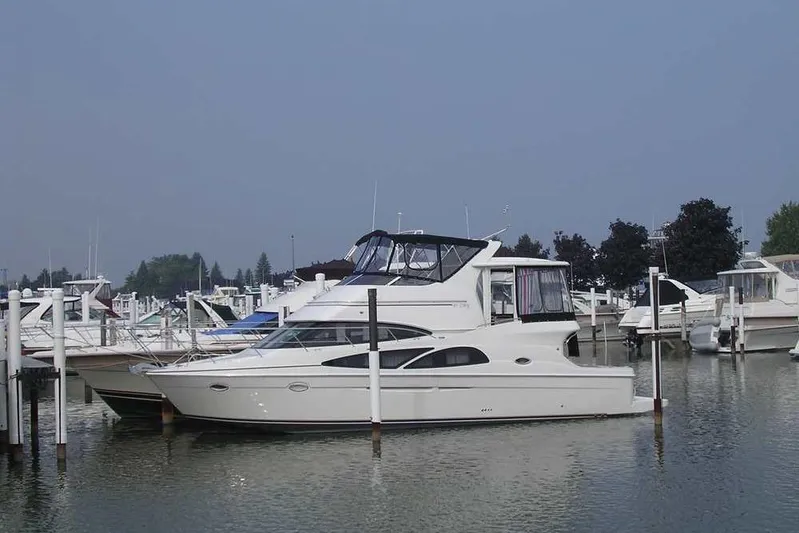  Yacht Photos Pics 2006 Carver 41 Cockpit Motor Yacht docked in a marina, surrounded by other boats.