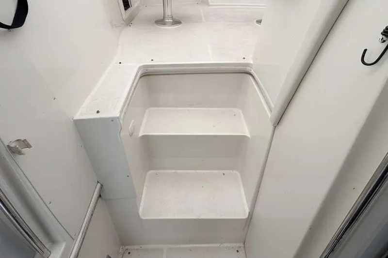  Yacht Photos Pics Staircase inside 2006 Carver 41 Cockpit Motor Yacht, featuring white steps and sleek design.